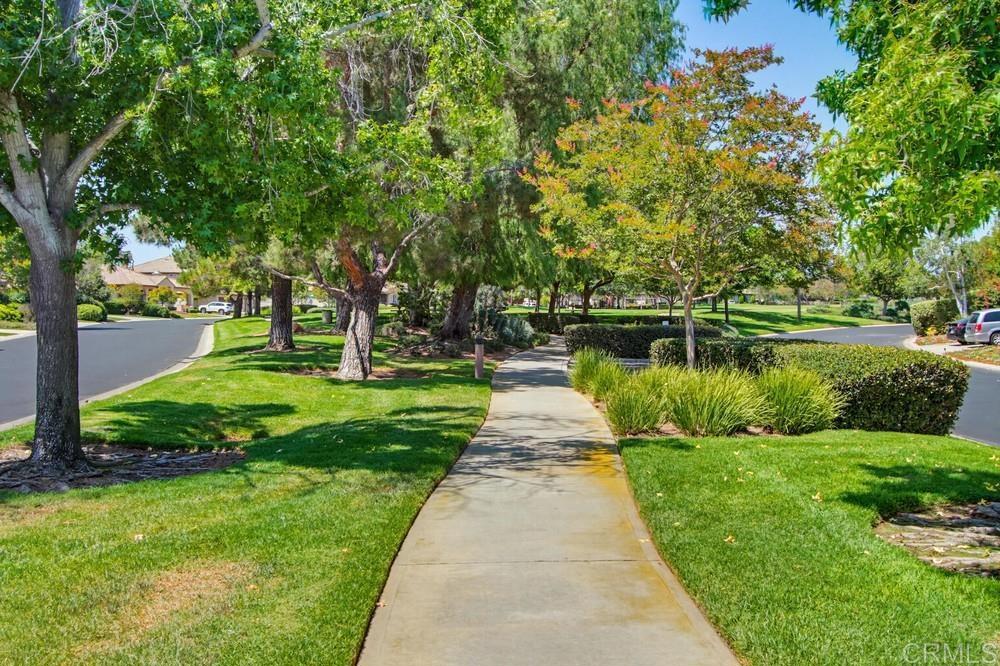 672 Inverlochy Drive Fallbrook, CA 92028 - Photo 71 of 75 a view of a lake with a big yard and large trees