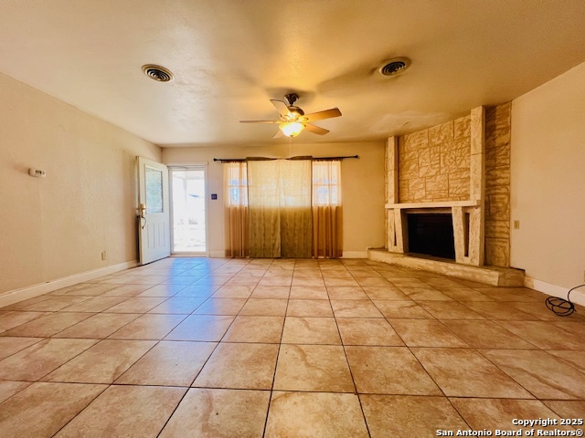 625 Oakhaven Road Pleasanton, TX 78064 - Photo 5 of 20 a view of an empty room with a fireplace and a window