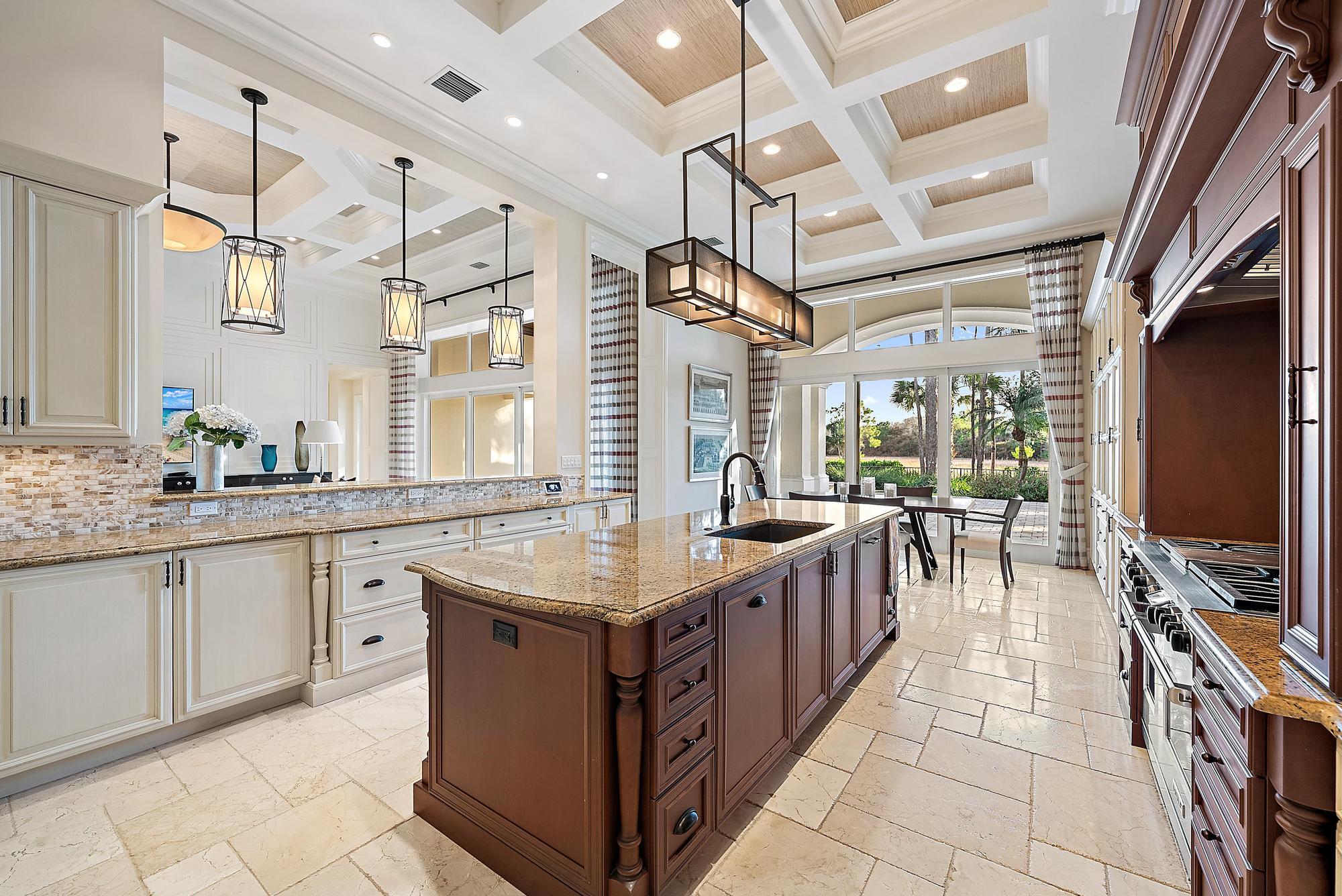 7770 Old Marsh Road Palm Beach Gardens, FL 33418 - Photo 11 of 45 a kitchen with sink stove and cabinets