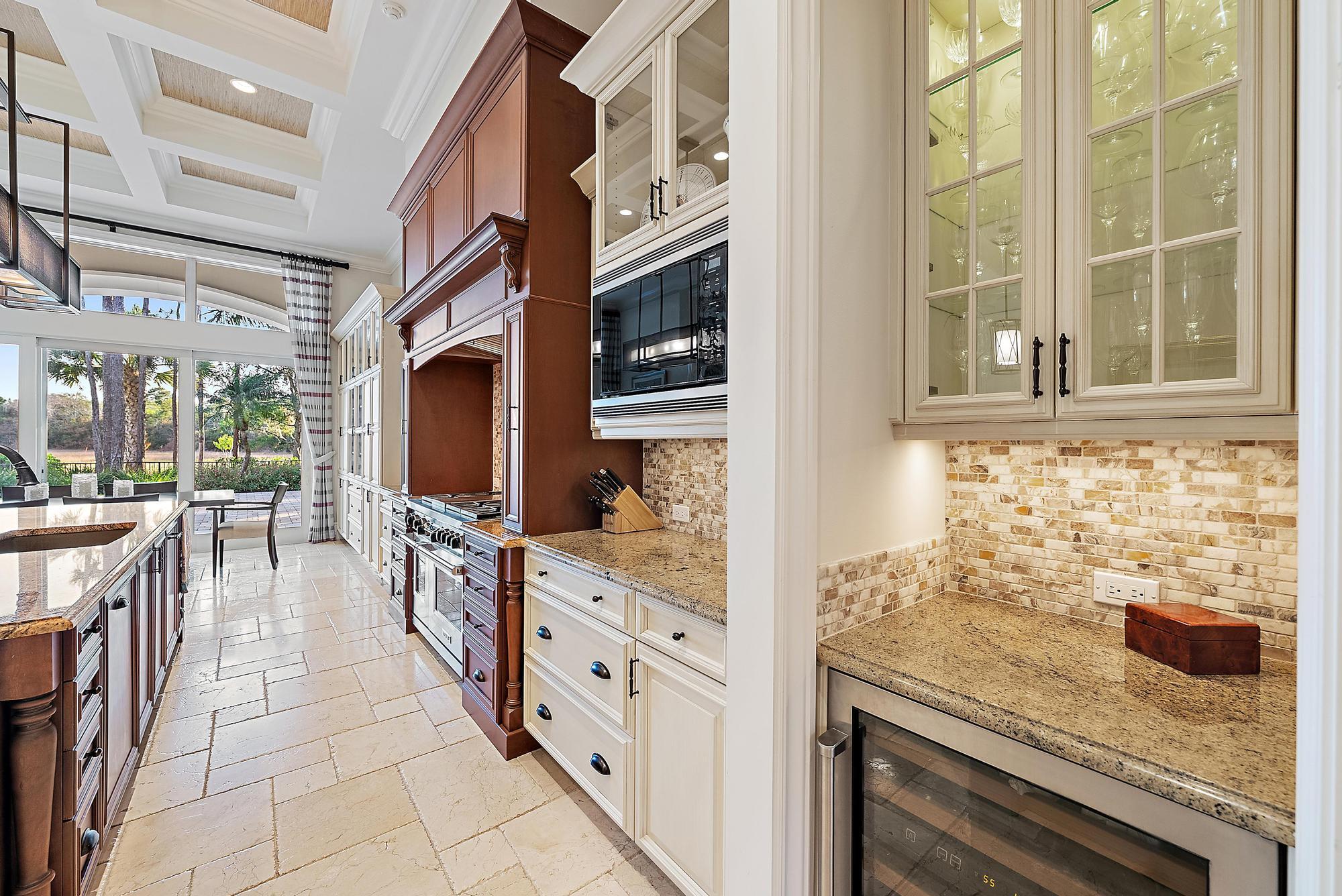 7770 Old Marsh Road Palm Beach Gardens, FL 33418 - Photo 12 of 45 a kitchen with stainless steel appliances granite countertop a stove and a sink