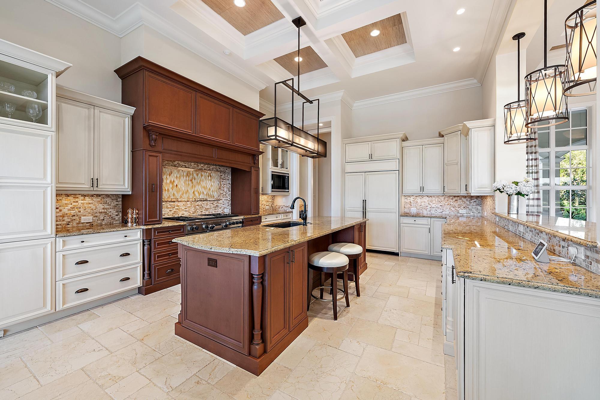 7770 Old Marsh Road Palm Beach Gardens, FL 33418 - Photo 13 of 45 a kitchen with a stove a sink and a refrigerator