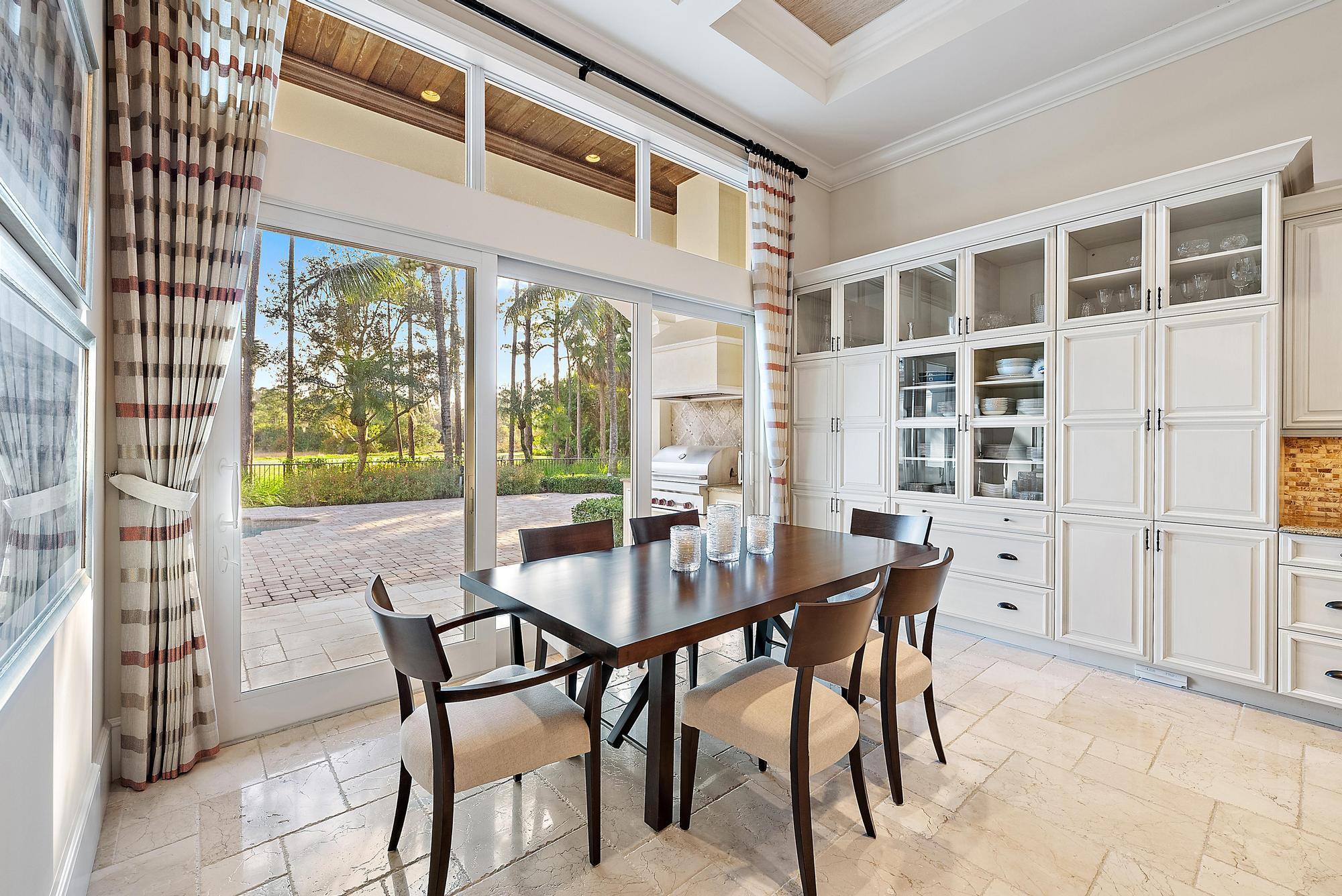 7770 Old Marsh Road Palm Beach Gardens, FL 33418 - Photo 14 of 45 a view of a dining room with furniture and a window