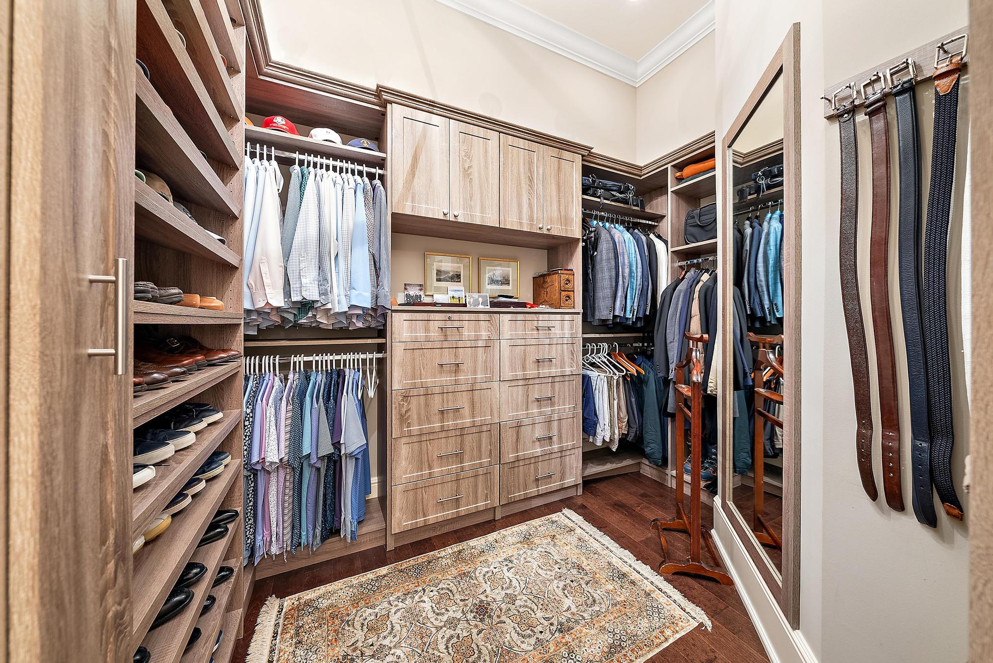 7770 Old Marsh Road Palm Beach Gardens, FL 33418 - Photo 22 of 45 a view of walk in closet and clothes