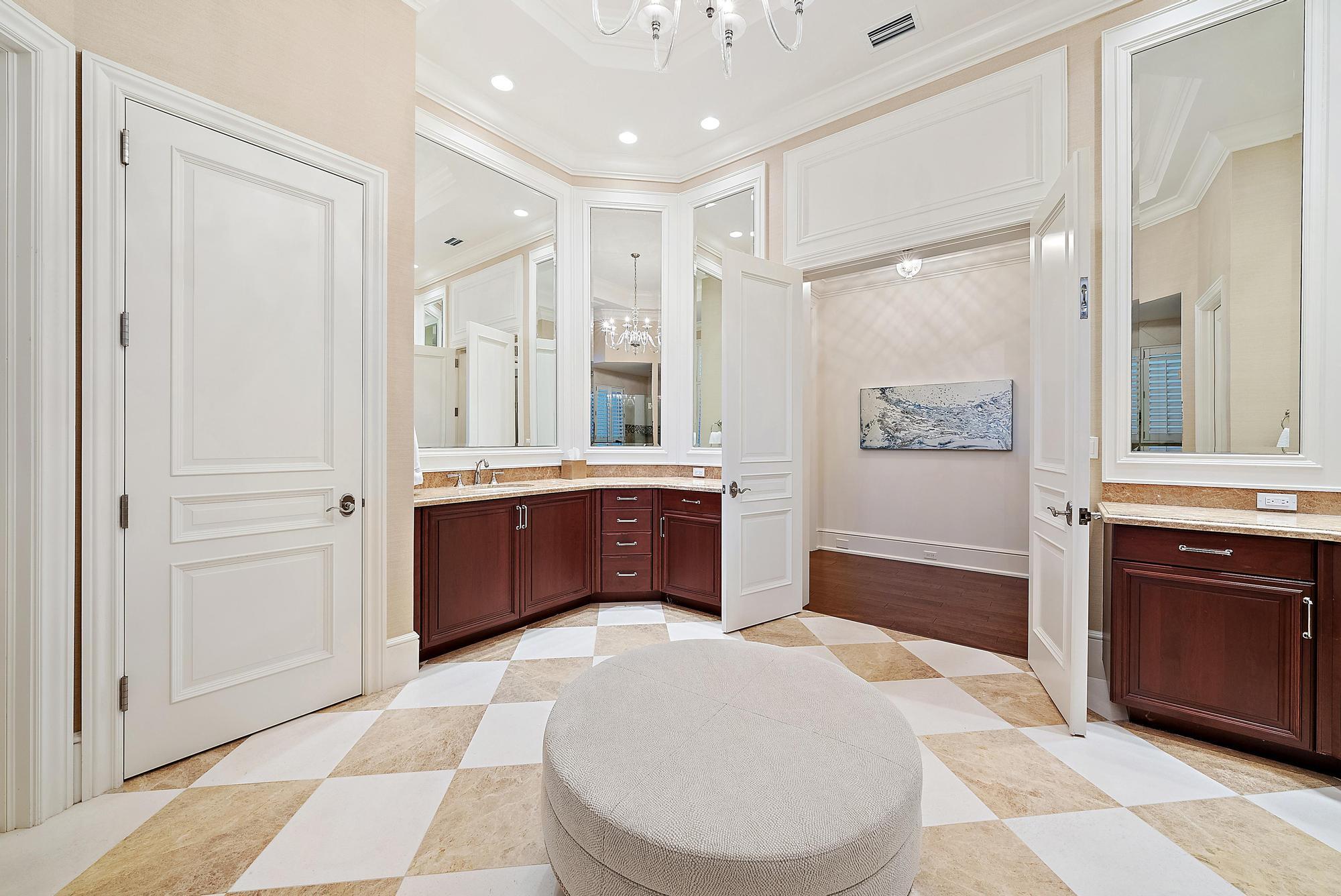7770 Old Marsh Road Palm Beach Gardens, FL 33418 - Photo 25 of 45 a spacious bathroom with a tub shower and mirror