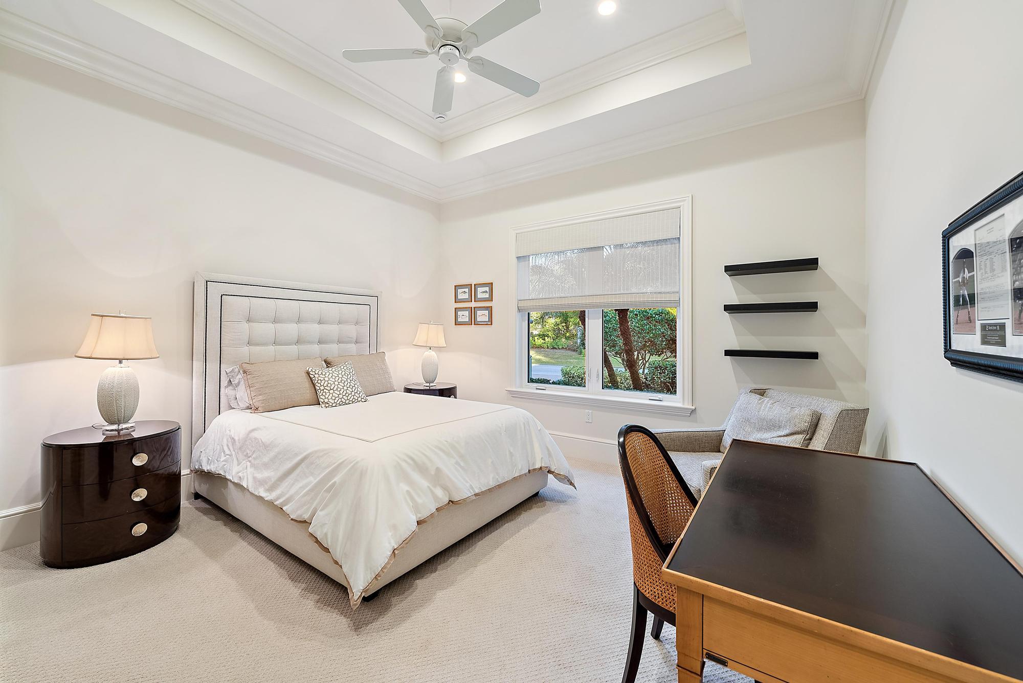 7770 Old Marsh Road Palm Beach Gardens, FL 33418 - Photo 27 of 45 a bedroom with a bed and a large window