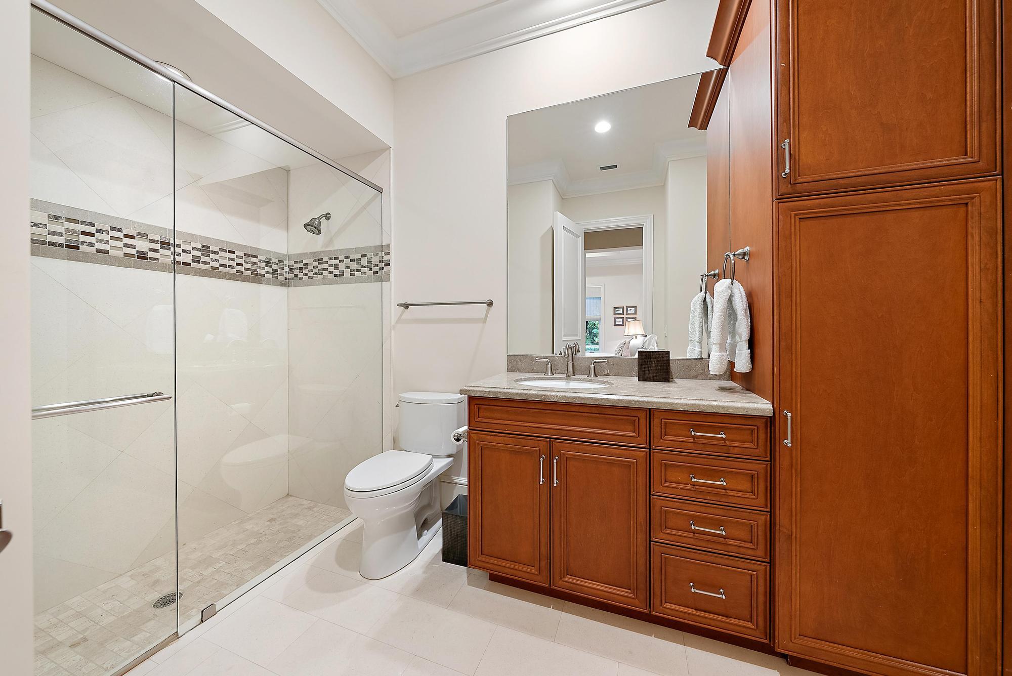 7770 Old Marsh Road Palm Beach Gardens, FL 33418 - Photo 28 of 45 a bathroom with a granite countertop sink toilet and shower