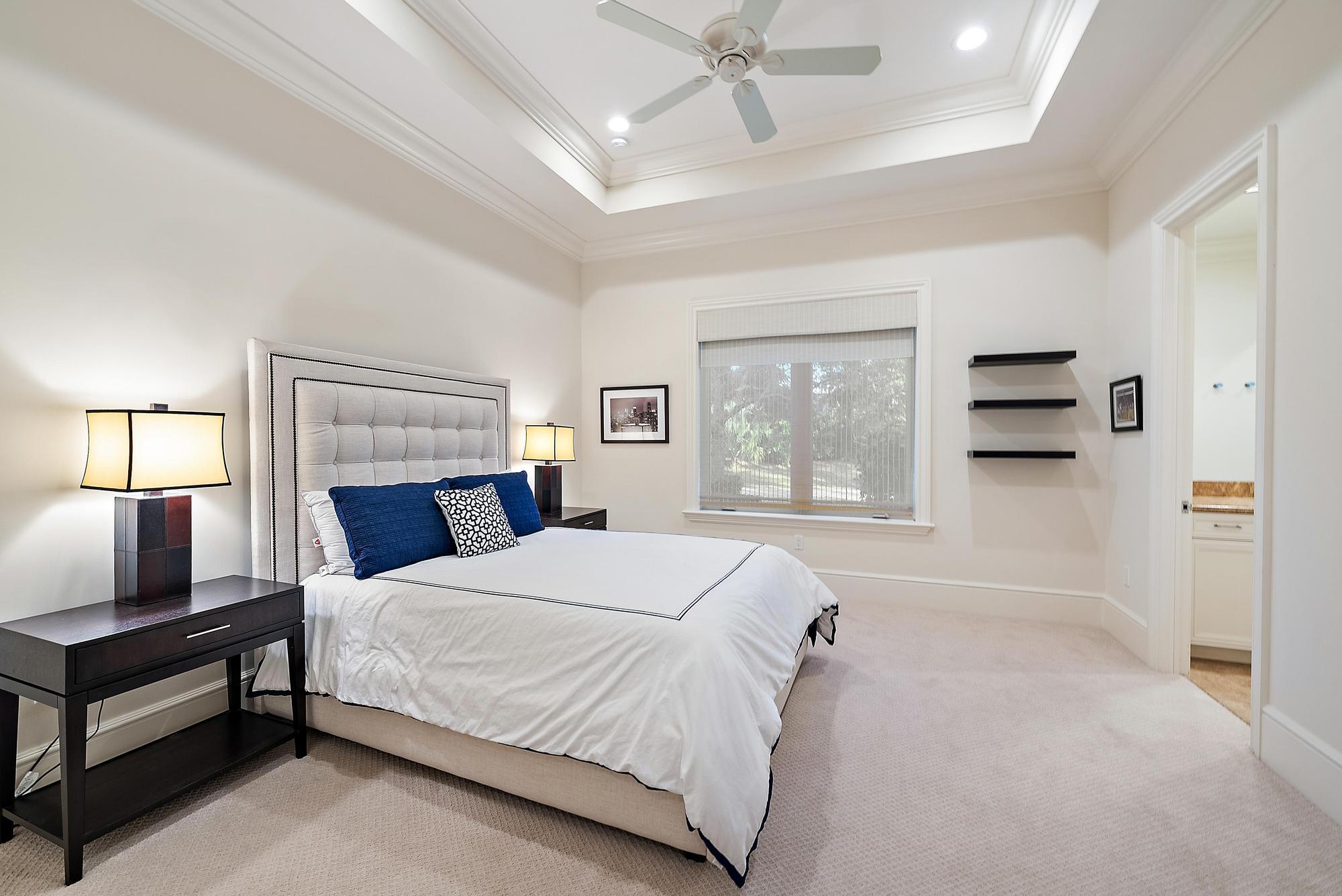 7770 Old Marsh Road Palm Beach Gardens, FL 33418 - Photo 29 of 45 a bedroom with a bed and window