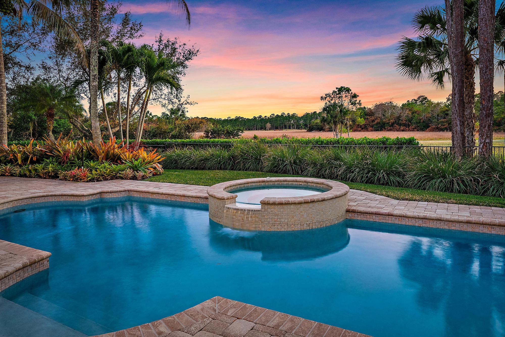 7770 Old Marsh Road Palm Beach Gardens, FL 33418 - Photo 3 of 45 a view of a swimming pool with a patio