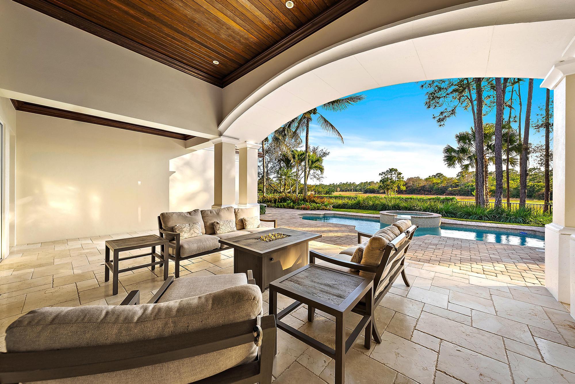 7770 Old Marsh Road Palm Beach Gardens, FL 33418 - Photo 33 of 45 a roof deck with outdoor seating and city view