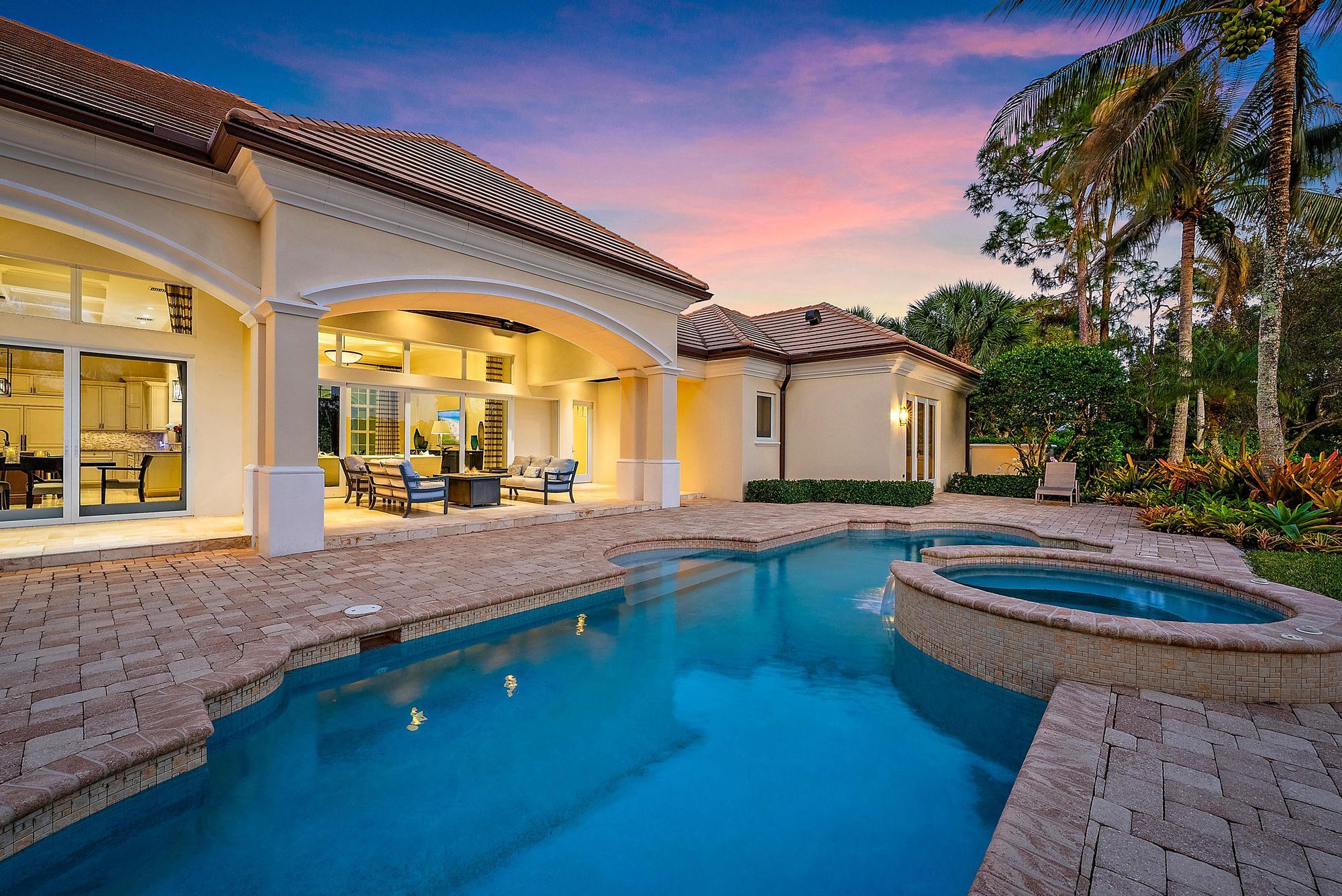 7770 Old Marsh Road Palm Beach Gardens, FL 33418 - Photo 34 of 45 a view of a house with swimming pool and sitting area