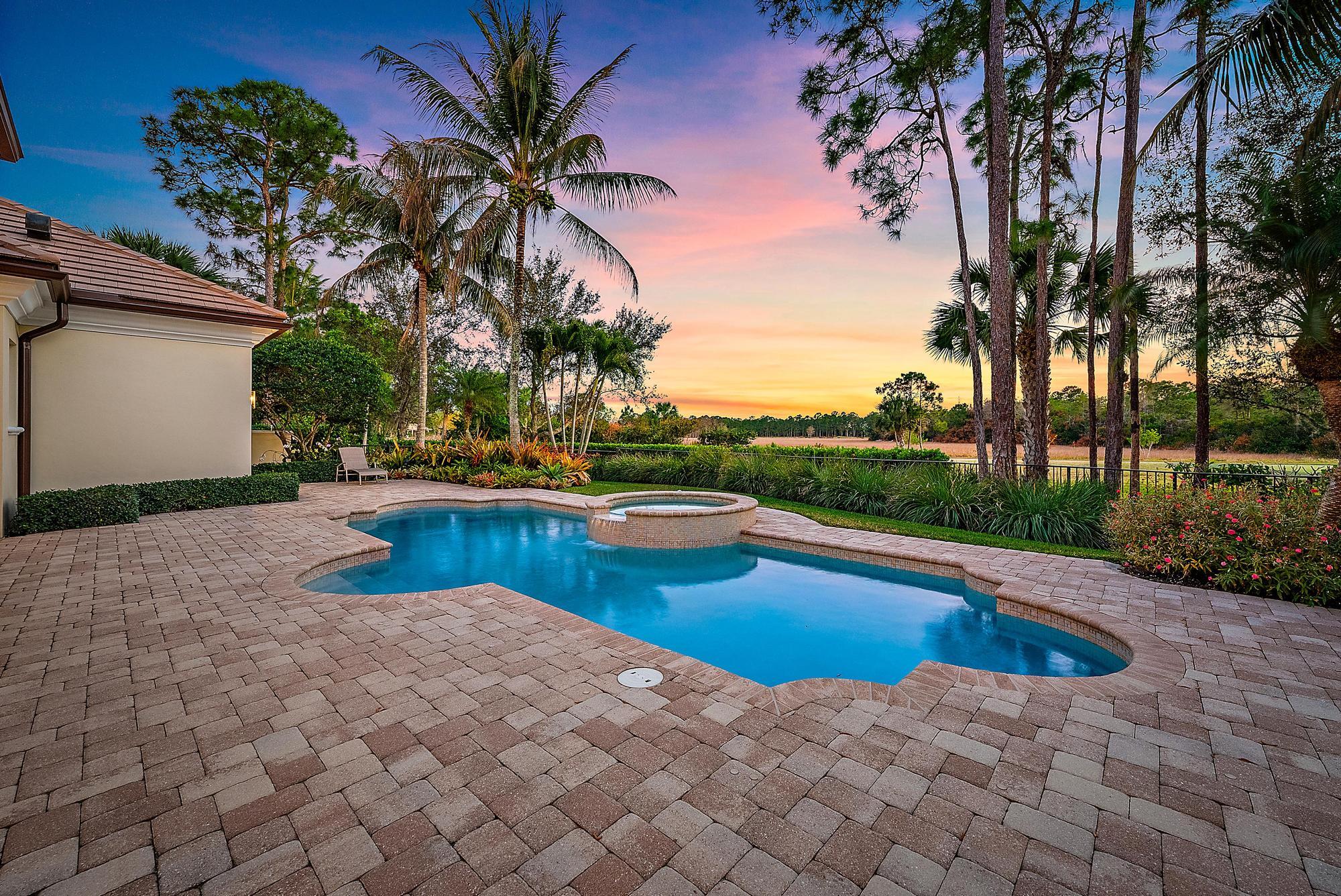 7770 Old Marsh Road Palm Beach Gardens, FL 33418 - Photo 35 of 45 a view of swimming pool with chair and table