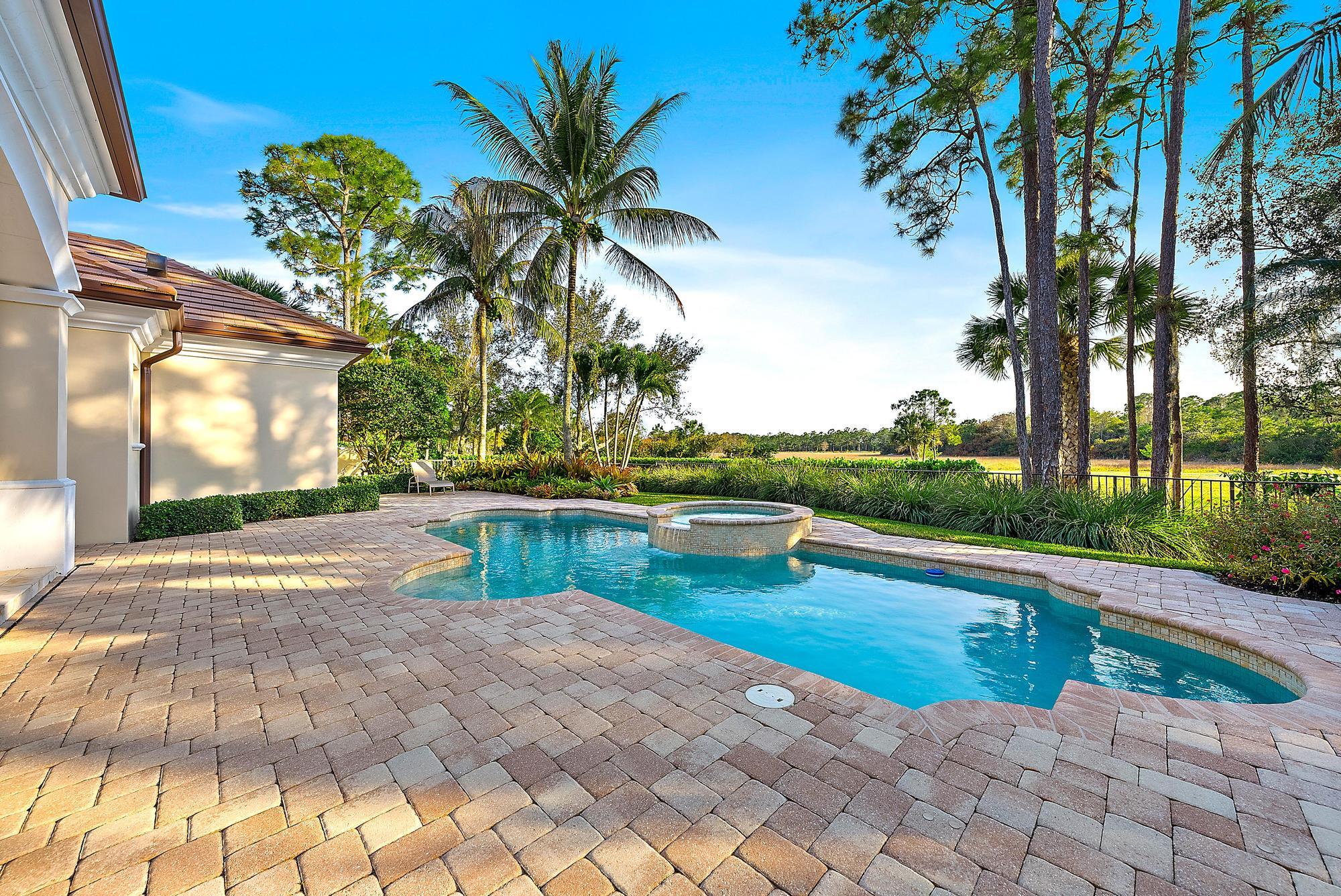 7770 Old Marsh Road Palm Beach Gardens, FL 33418 - Photo 36 of 45 a view of swimming pool with a patio
