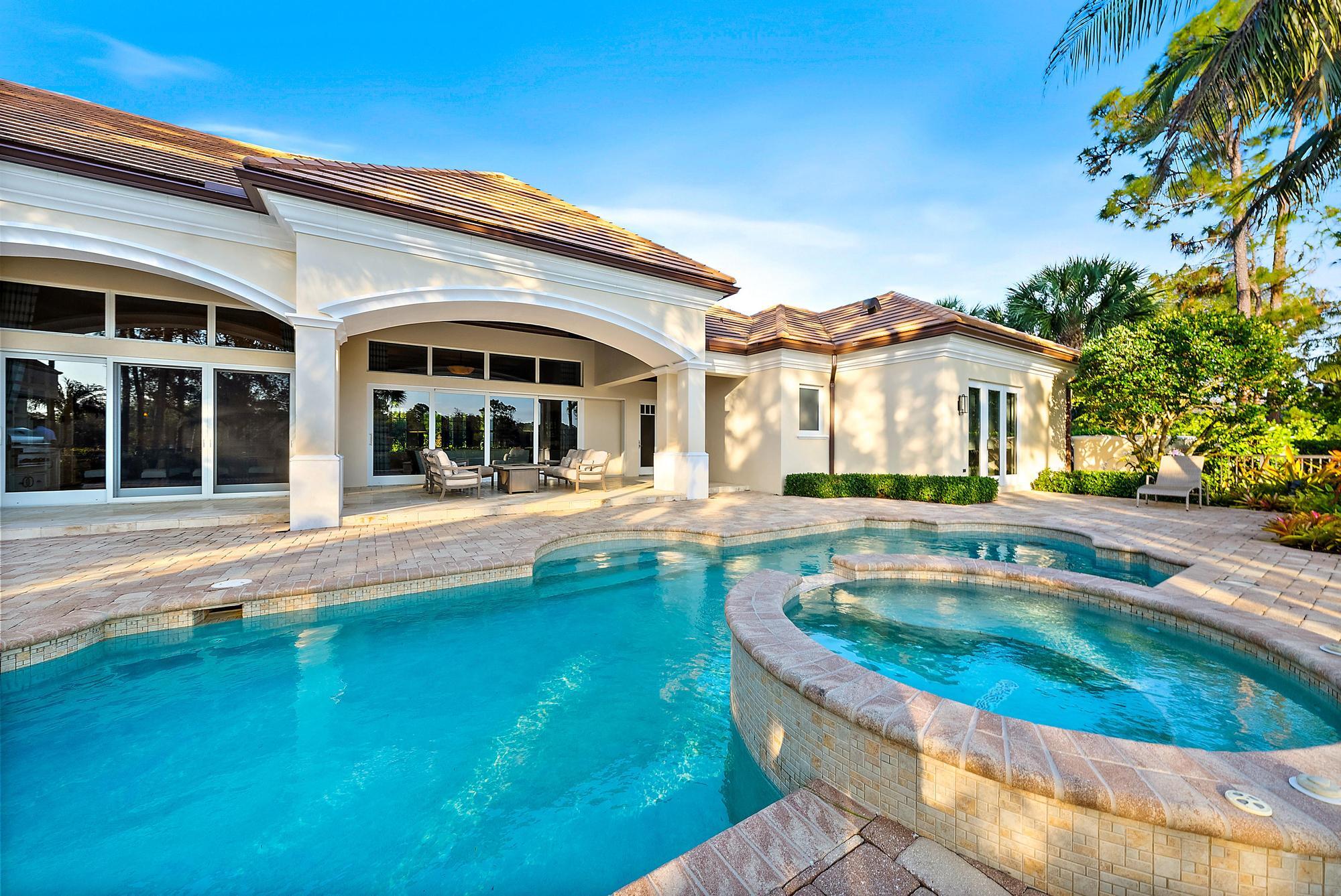7770 Old Marsh Road Palm Beach Gardens, FL 33418 - Photo 39 of 45 front view of a house with a swimming pool
