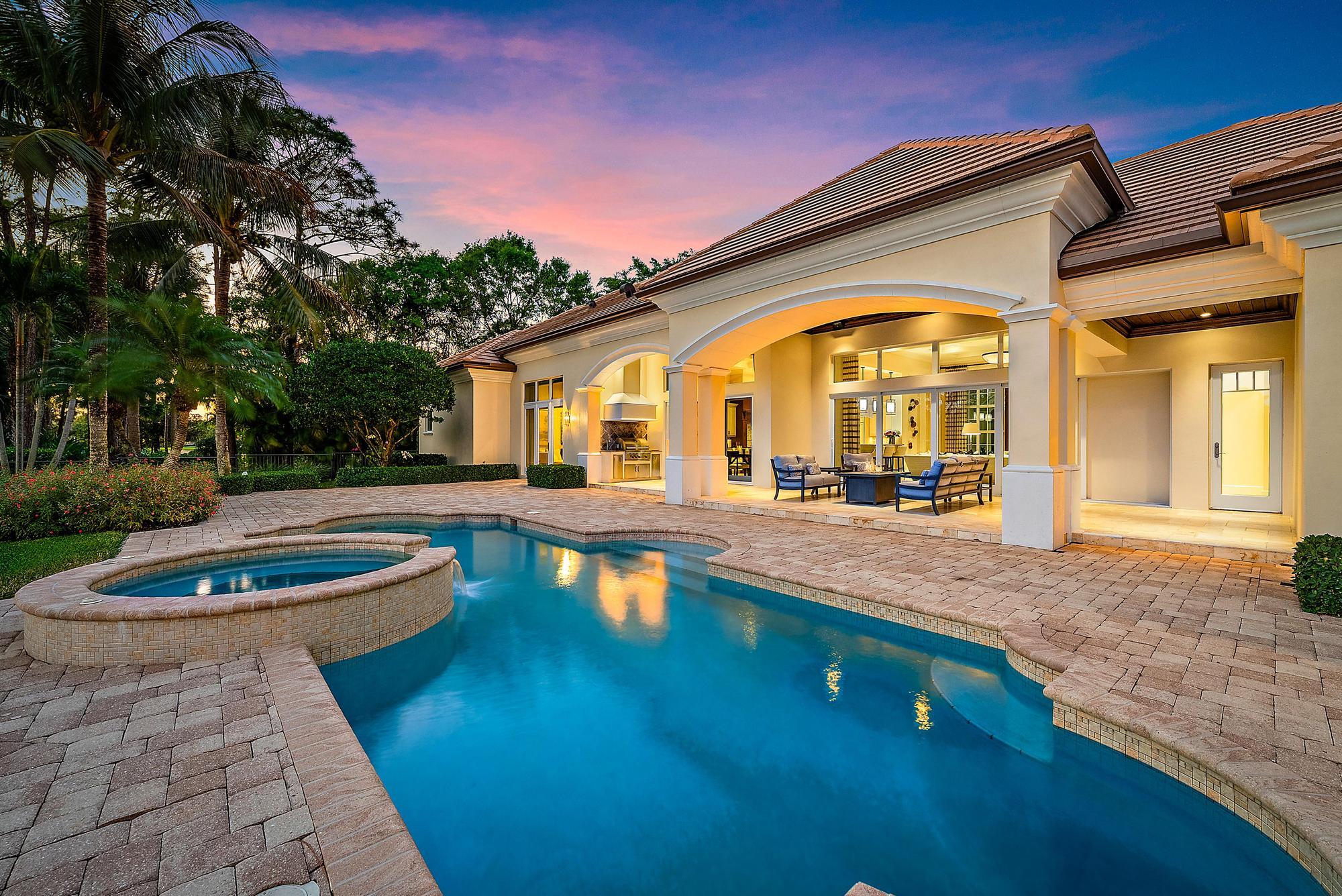 7770 Old Marsh Road Palm Beach Gardens, FL 33418 - Photo 40 of 45 a view of a house with swimming pool and sitting area