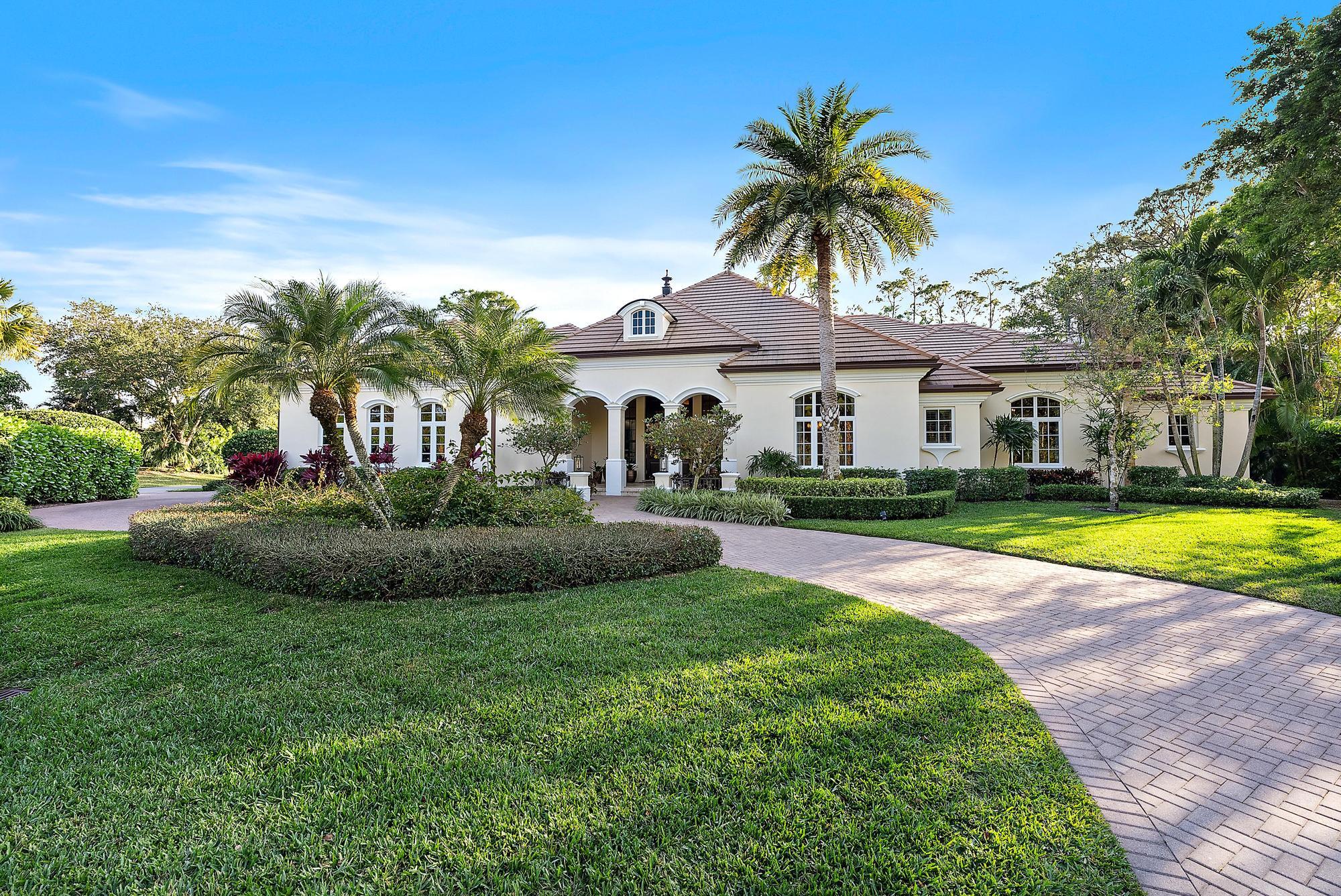 7770 Old Marsh Road Palm Beach Gardens, FL 33418 - Photo 5 of 45 a view of a house with a swimming pool and a yard