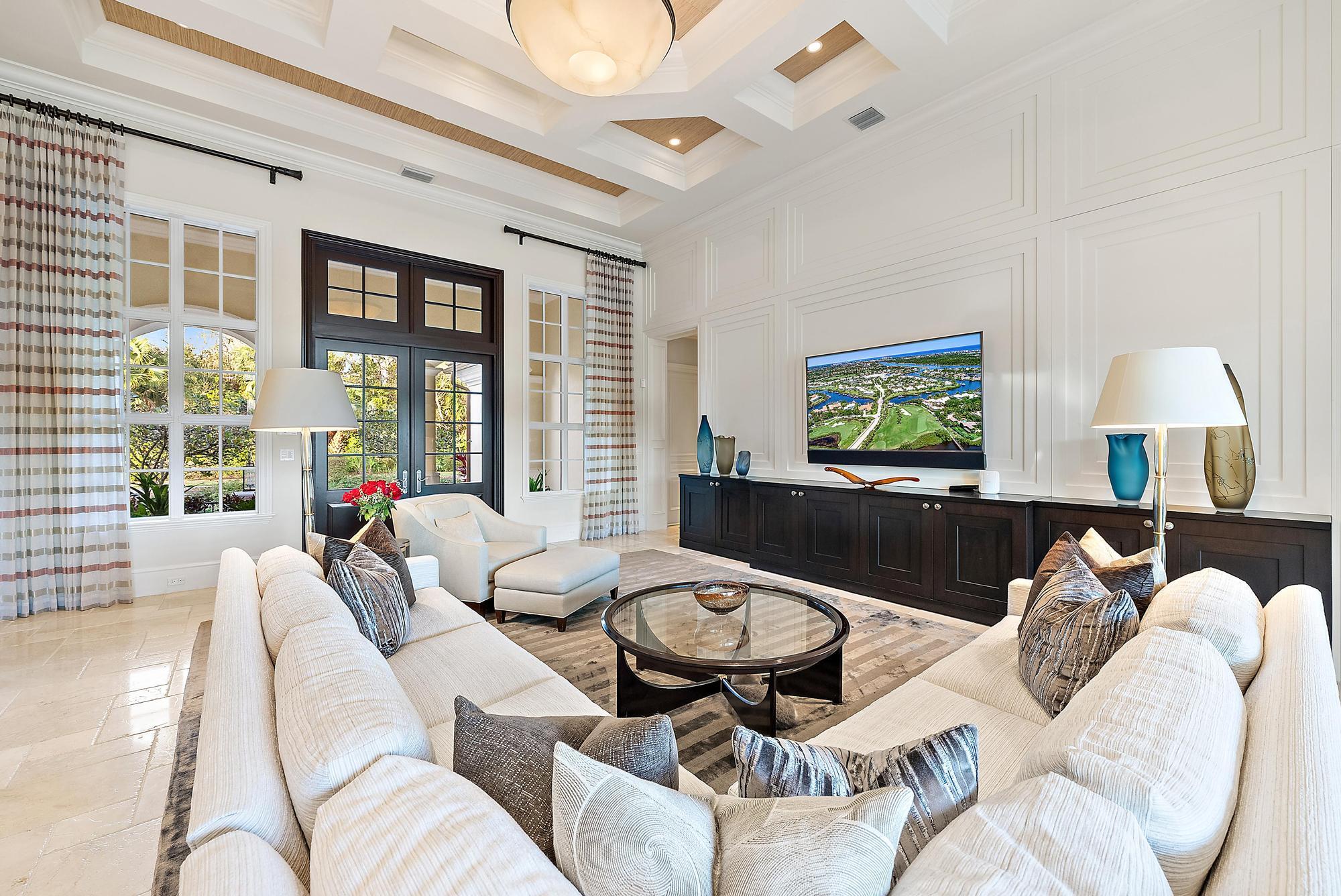 7770 Old Marsh Road Palm Beach Gardens, FL 33418 - Photo 7 of 45 a living room with furniture and a flat screen tv
