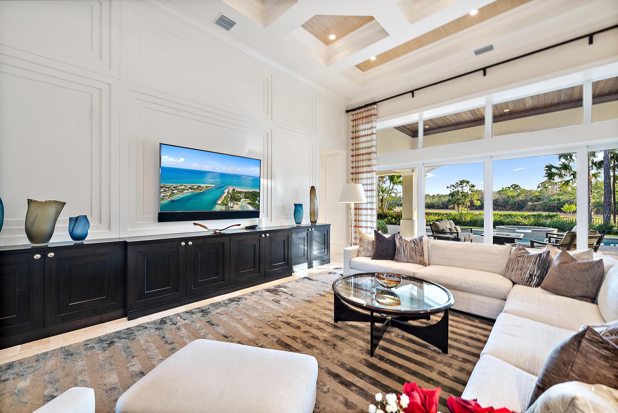 7770 Old Marsh Road Palm Beach Gardens, FL 33418 - Photo 8 of 45 a living room with furniture and a flat screen tv