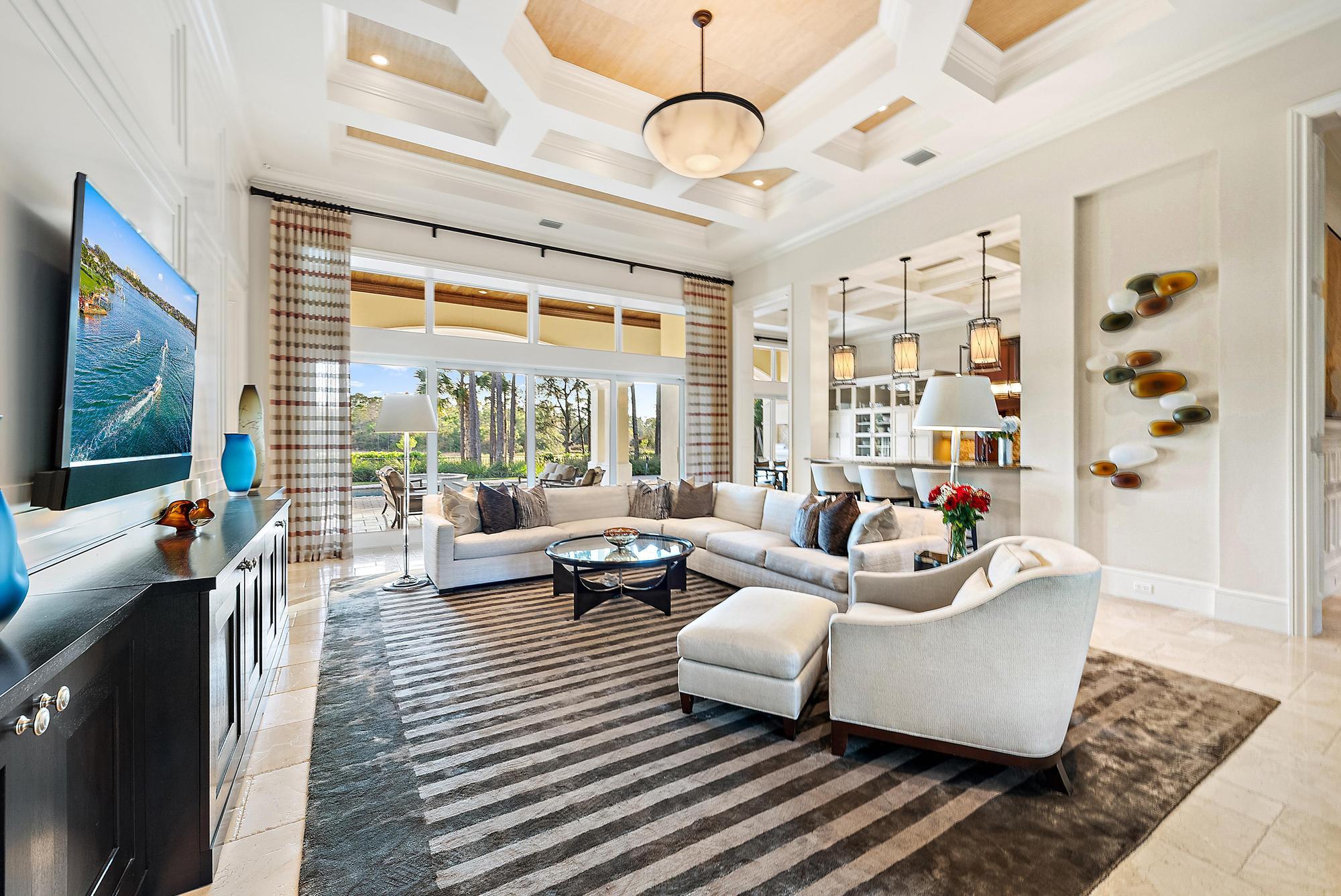 7770 Old Marsh Road Palm Beach Gardens, FL 33418 - Photo 9 of 45 a living room with furniture and a flat screen tv