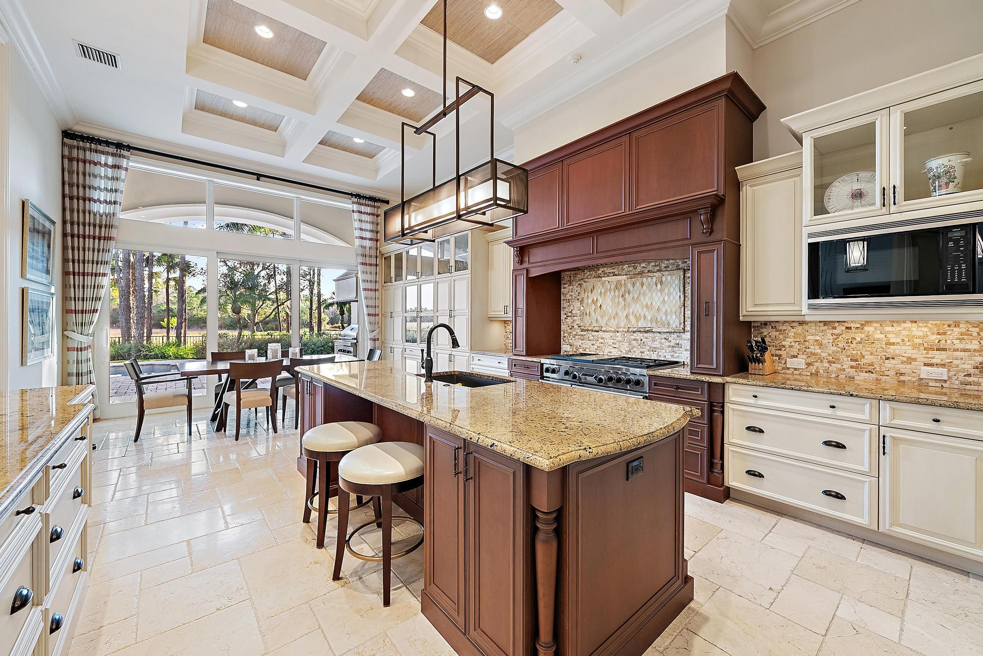 7770 Old Marsh Road Palm Beach Gardens, FL 33418 - Photo 10 of 45 a dining hall with stainless steel appliances granite countertop a stove and a sink