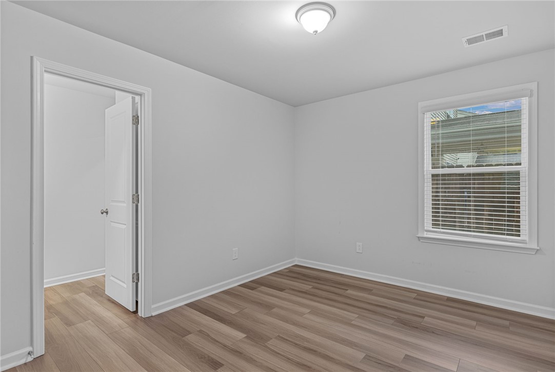 24 Chalet Court Anderson, SC 29621 - Photo 21 of 39 This bright and airy room offers a fresh canvas with durable flooring and natural light.