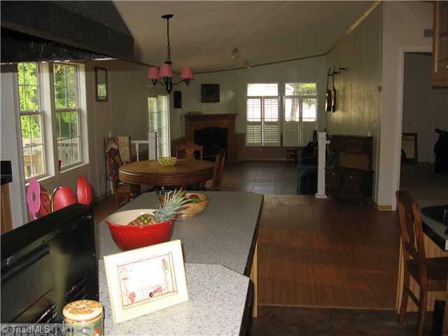 1183 Kallam Farm Road Sandy Ridge, NC 27046 - Photo 6 of 16 Kitchen. Kitchen Looking into Open Dining Room and Den
