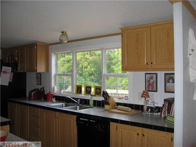 1183 Kallam Farm Road Sandy Ridge, NC 27046 - Photo 7 of 16 Kitchen. Large Window Over Kitchen Sink