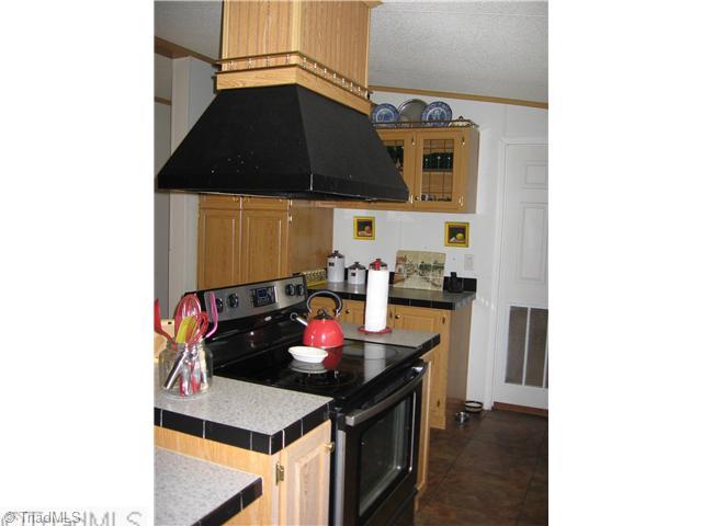 1183 Kallam Farm Road Sandy Ridge, NC 27046 - Photo 8 of 16 Kitchen. New Stove