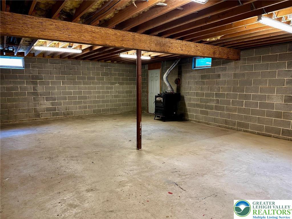1125 Bridle Path Road Bethlehem, PA 18017 - Photo 47 of 70 Large open space with coal stove