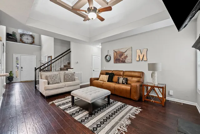 a living room with furniture and a rug