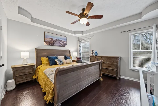 a bedroom with bed and a window