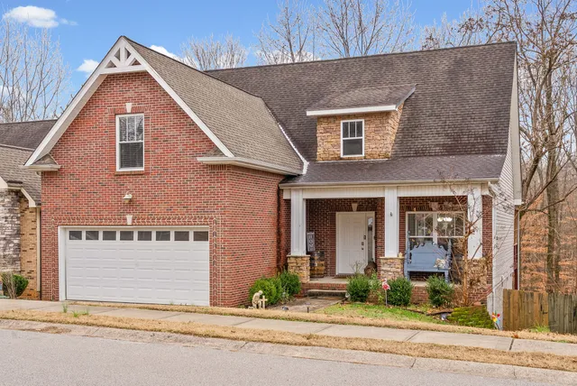 a front view of a house with small garden