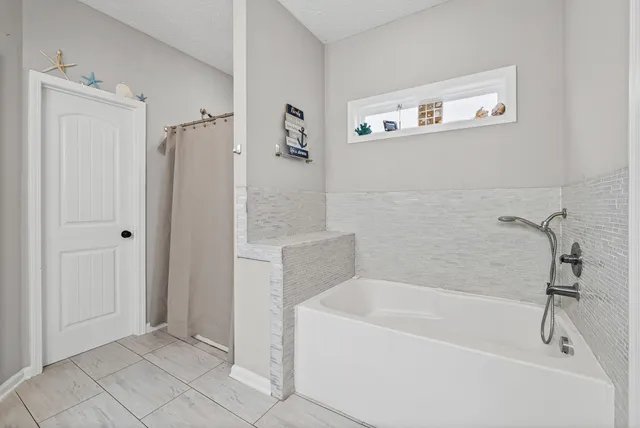 a bathroom with a bathtub