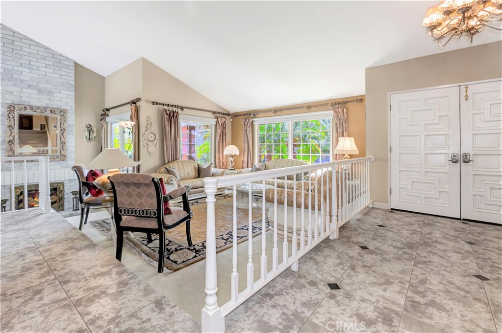 25641 Rapid Falls Road Laguna Hills, CA 92653 - Photo 12 of 50 a living room with furniture and a baby crib