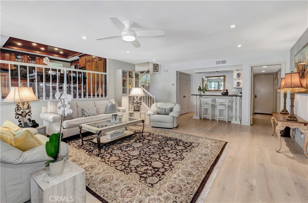 25641 Rapid Falls Road Laguna Hills, CA 92653 - Photo 19 of 50 a living room with furniture and wooden floor