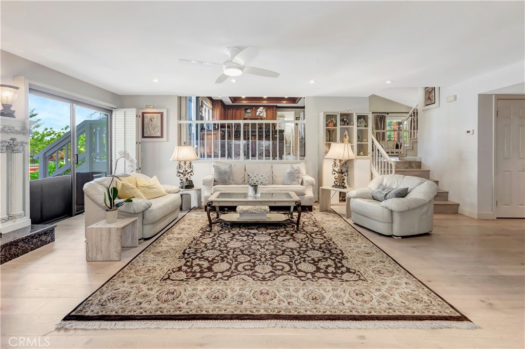 25641 Rapid Falls Road Laguna Hills, CA 92653 - Photo 21 of 50 a living room with furniture and a rug