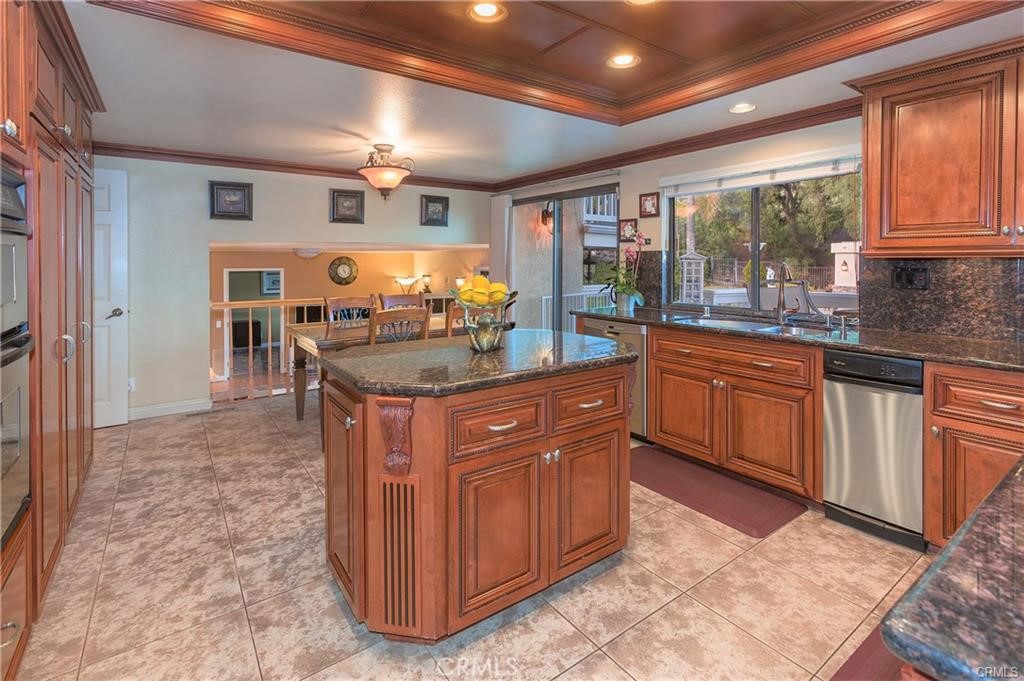 25641 Rapid Falls Road Laguna Hills, CA 92653 - Photo 28 of 50 a kitchen with stainless steel appliances granite countertop a sink and cabinets