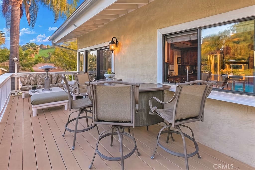 25641 Rapid Falls Road Laguna Hills, CA 92653 - Photo 30 of 50 a view of a patio with table and chairs