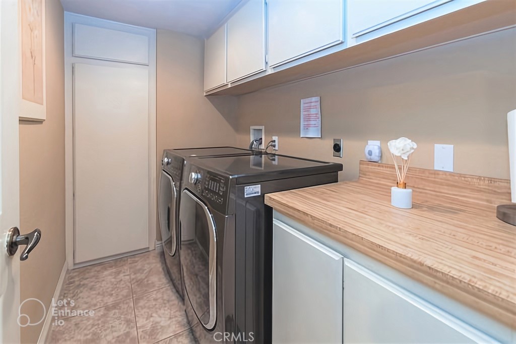 25641 Rapid Falls Road Laguna Hills, CA 92653 - Photo 34 of 50 a utility room with sink dryer and washer