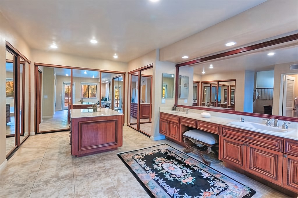 25641 Rapid Falls Road Laguna Hills, CA 92653 - Photo 39 of 50 a large spacious bathroom with stainless steel appliances granite countertop a stove a sink and a refrigerator