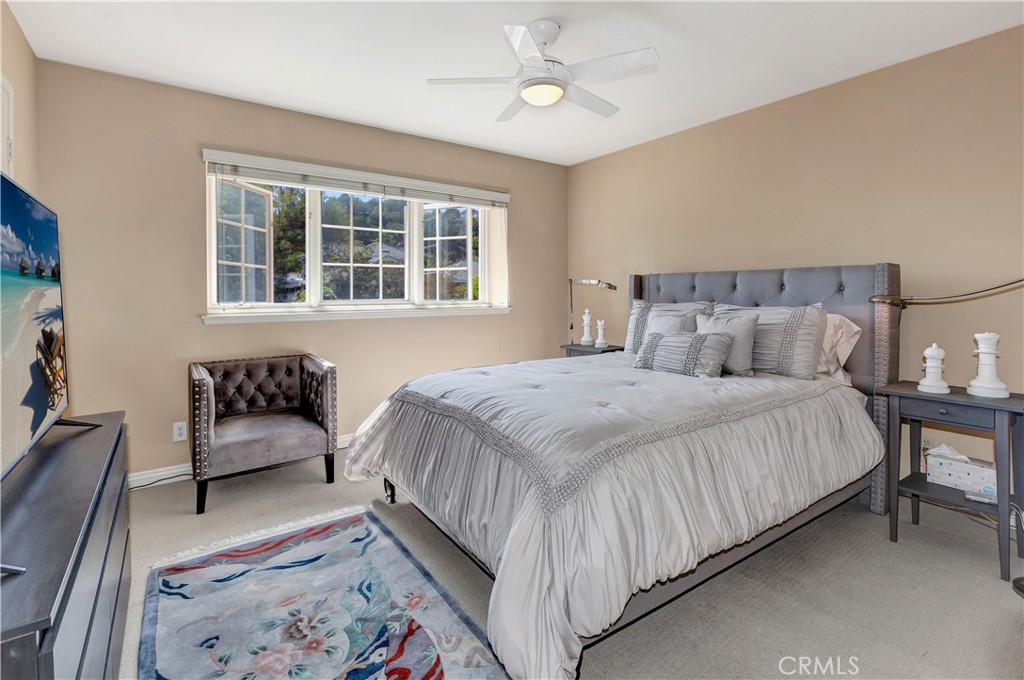 25641 Rapid Falls Road Laguna Hills, CA 92653 - Photo 42 of 50 a bedroom with a bed and a couch