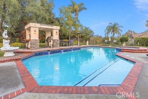 25641 Rapid Falls Road Laguna Hills, CA 92653 - Photo 45 of 50 a view of a swimming pool with a patio