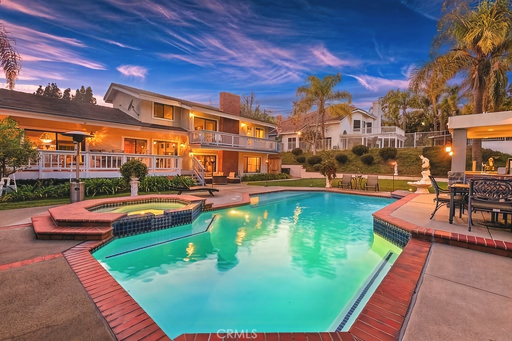 25641 Rapid Falls Road Laguna Hills, CA 92653 - Photo 9 of 50 a swimming pool with outdoor seating and yard