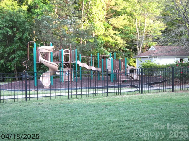 a front view of house with a garden
