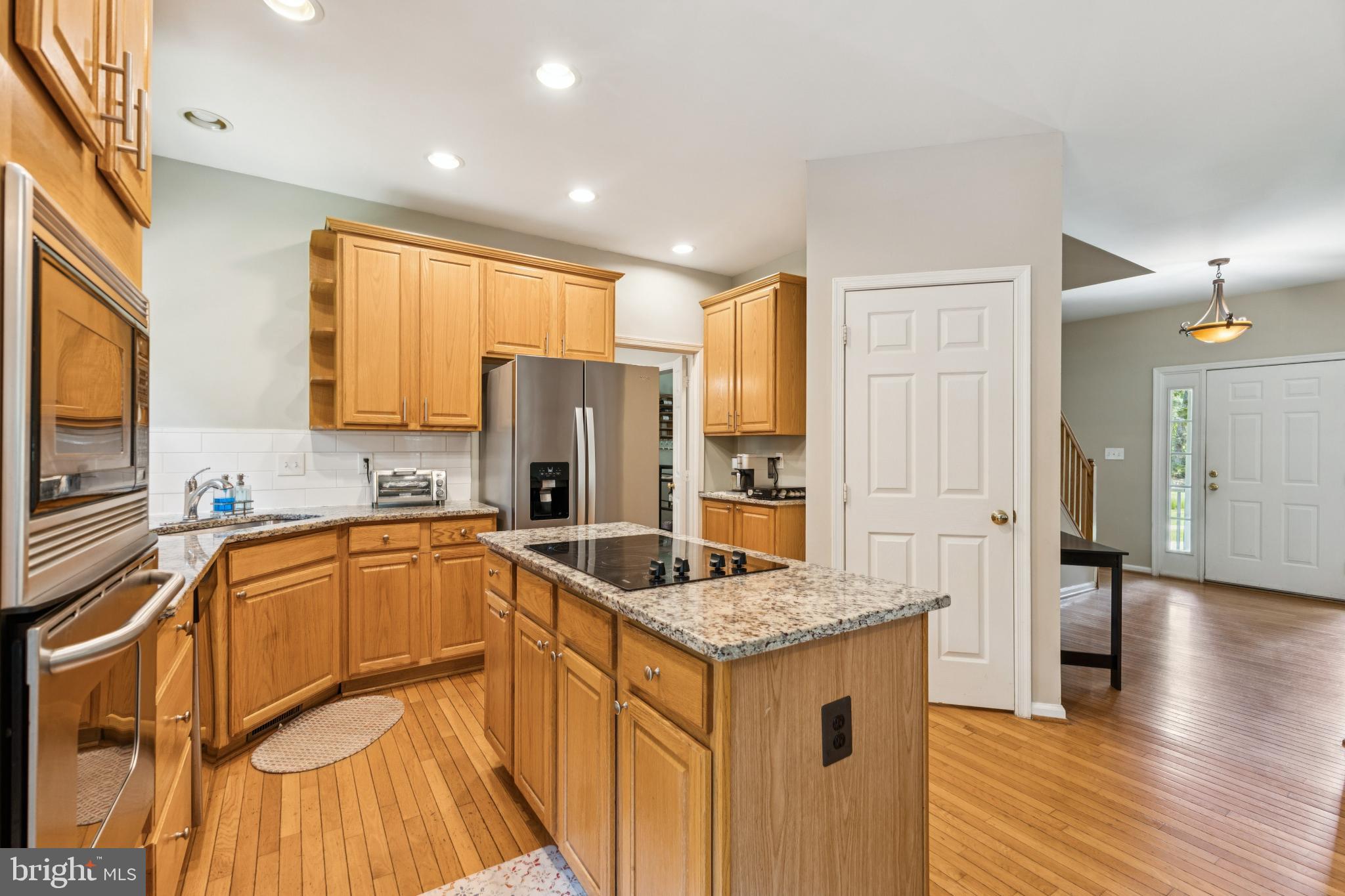 3404 Holly Circle Triangle, VA 22172 - Photo 64 of 68 Modern kitchen with warm wood accents.