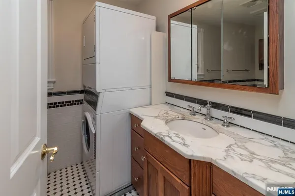 a bathroom with a toilet a sink and a window