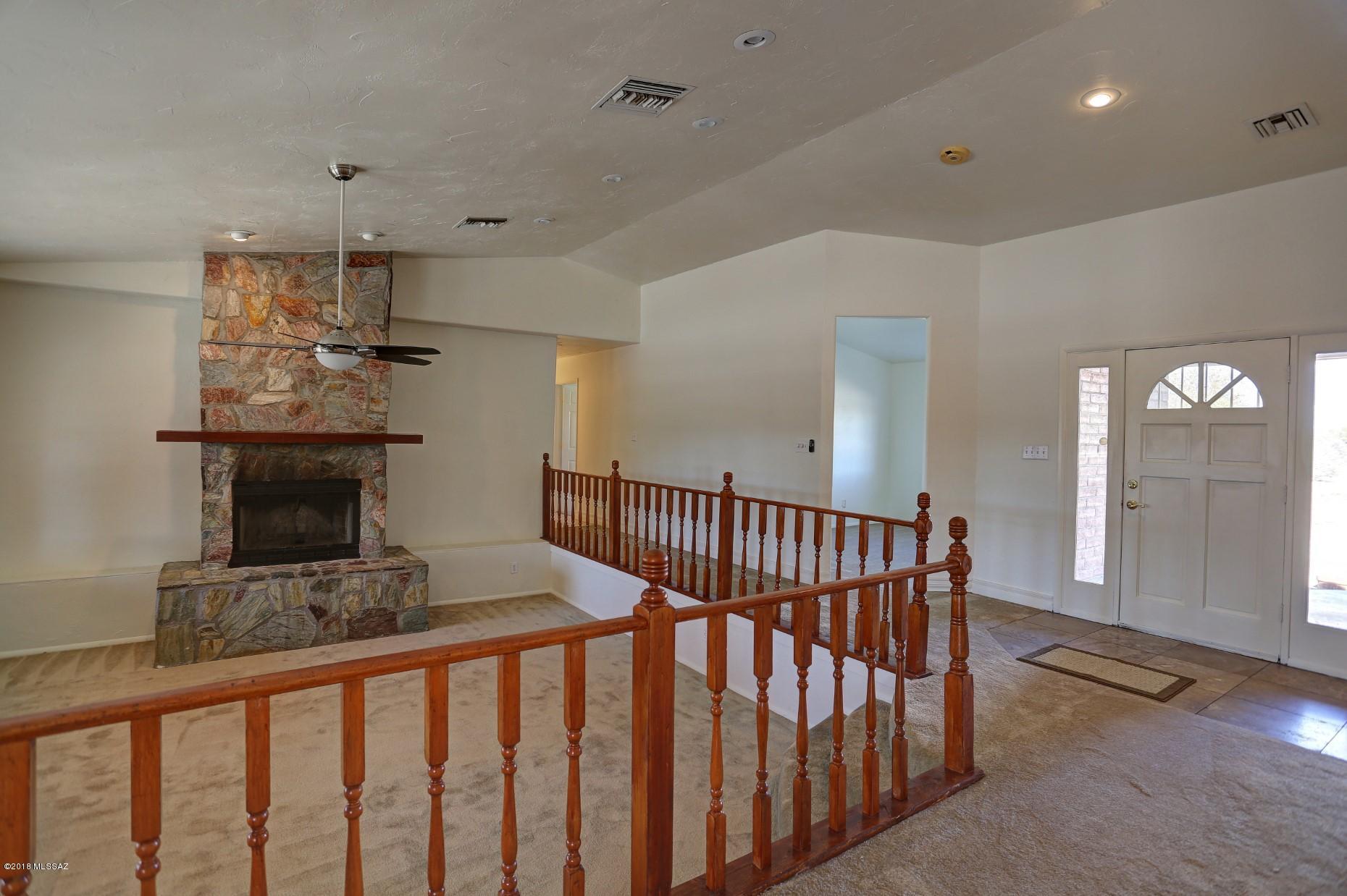 5851 South Avra Road Tucson, AZ 85735 - Photo 10 of 46 a view of a hallway with seating area