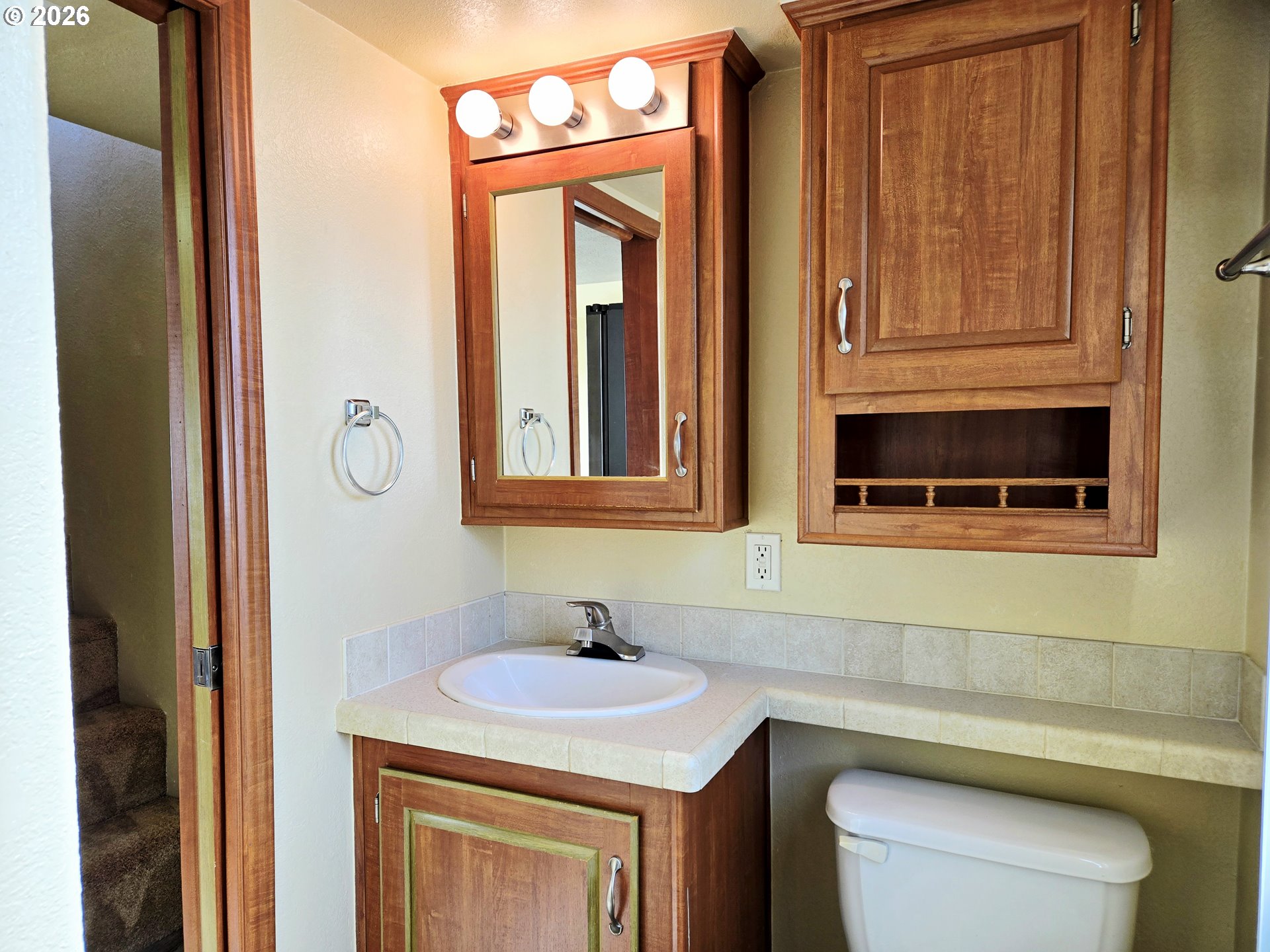 16219 Lower Harbor Road, Unit 18 Brookings, OR 97415 - Photo 20 of 38 a bathroom with a sink and a toilet