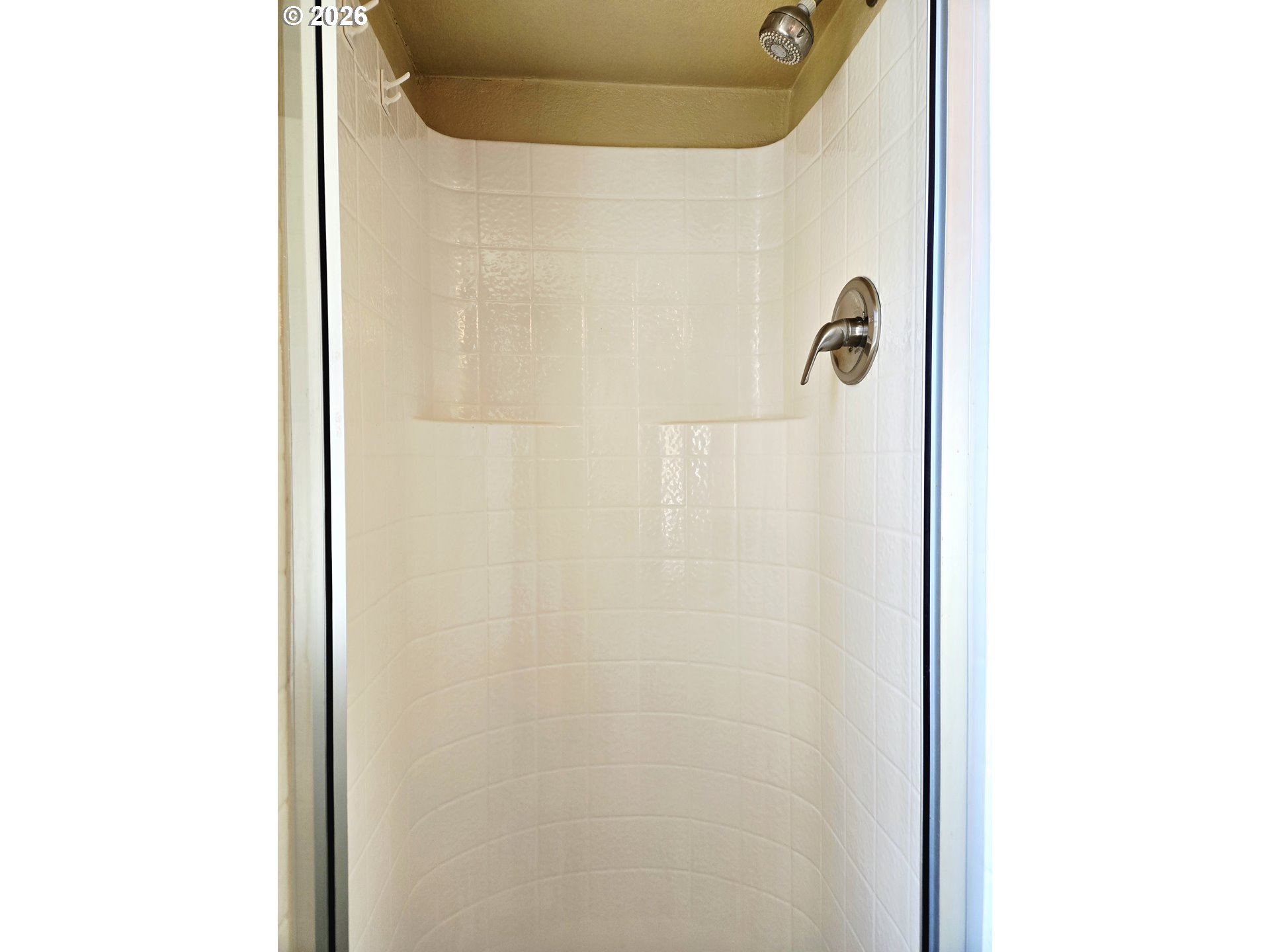 16219 Lower Harbor Road, Unit 18 Brookings, OR 97415 - Photo 22 of 38 a bathroom with a shower