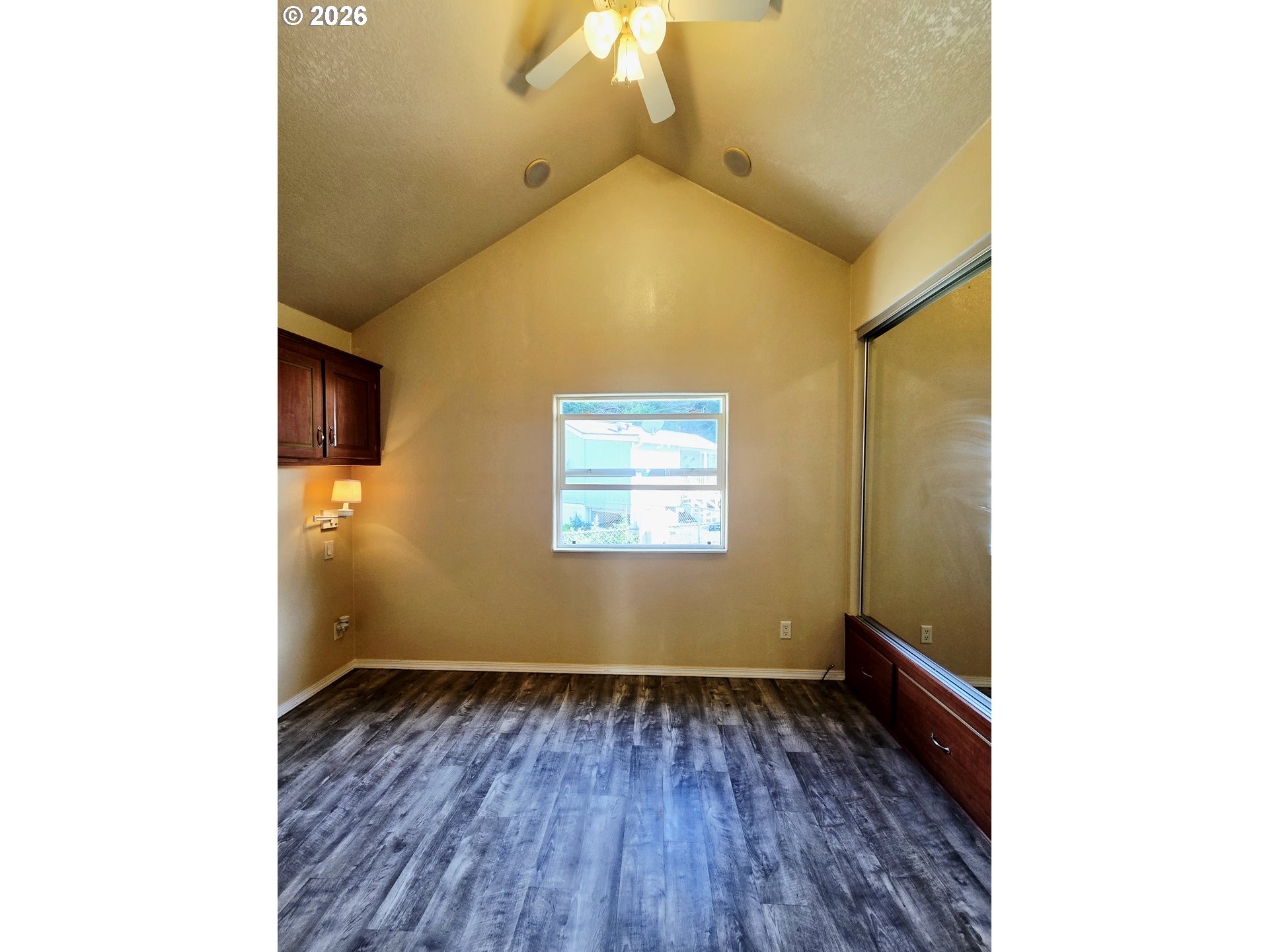 16219 Lower Harbor Road, Unit 18 Brookings, OR 97415 - Photo 23 of 38 a view of room with window and wooden floor