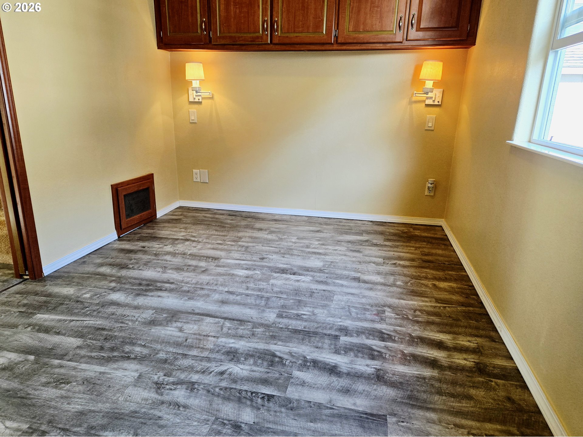 16219 Lower Harbor Road, Unit 18 Brookings, OR 97415 - Photo 24 of 38 a view of a room with wooden floor and a window